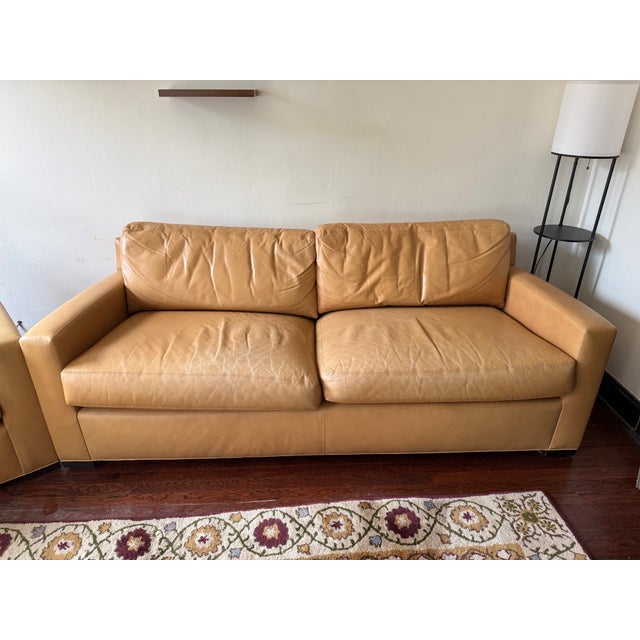 A genuine piece of design history: this sofa and matching club chair are from a rare collaboration between Baker Furniture...