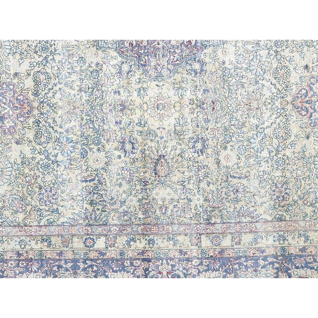 This semi-antique Kerman rug exemplifies the refined craftsmanship of Iran's most prestigious weaving center. Hand-woven...