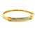 A timeless vintage hinged bangle crafted in solid 14K yellow gold and accented with fourteen round brilliant-cut diamonds...