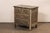 French carved and painted wood commode with faux marble top. This vintage chest from France has a rectangular-shaped top...