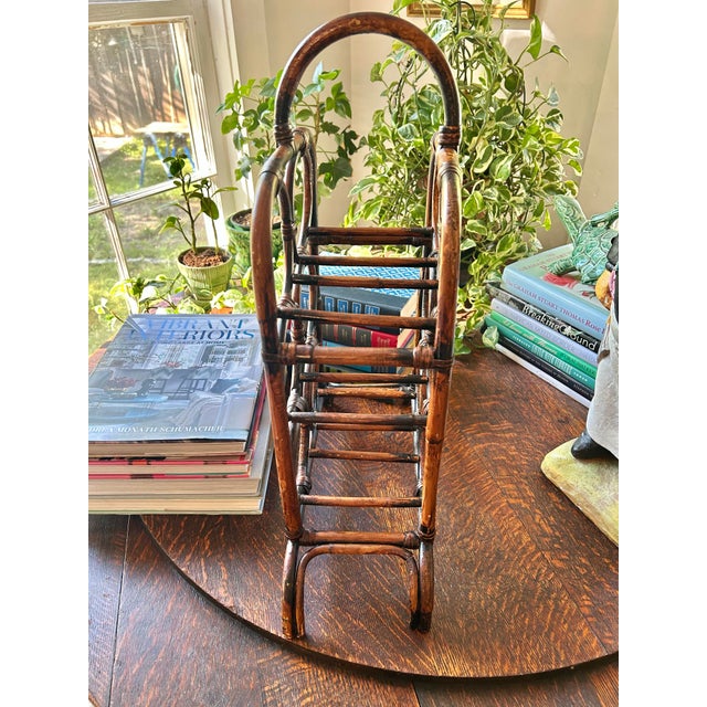 From the mid to late 20th century, this wine bottle holder holds 6 bottles and is perfect for your home bar. The bent...