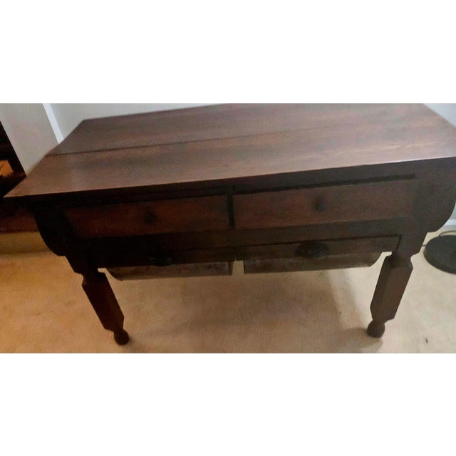 This antique possum belly baker's table (also known as a "pot belly" or "doughboy" table) dates from the late 19th to...