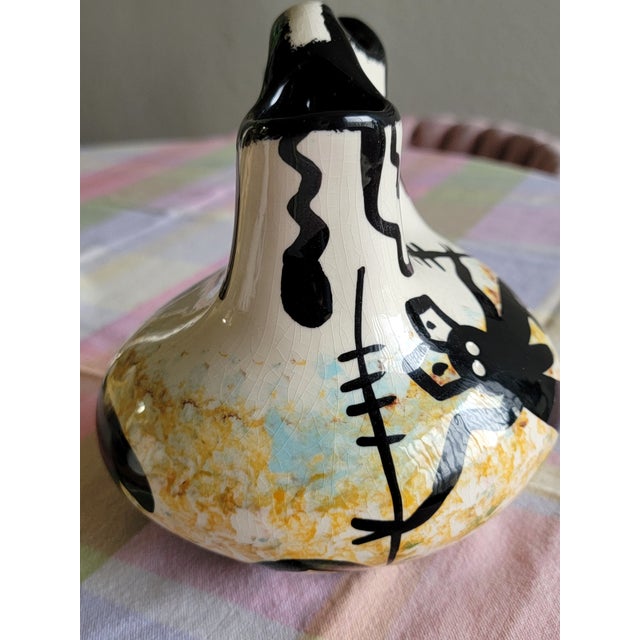 This is a traditional double-spouted "wedding vase" shape, where the two spouts represent the individual lives of a couple...