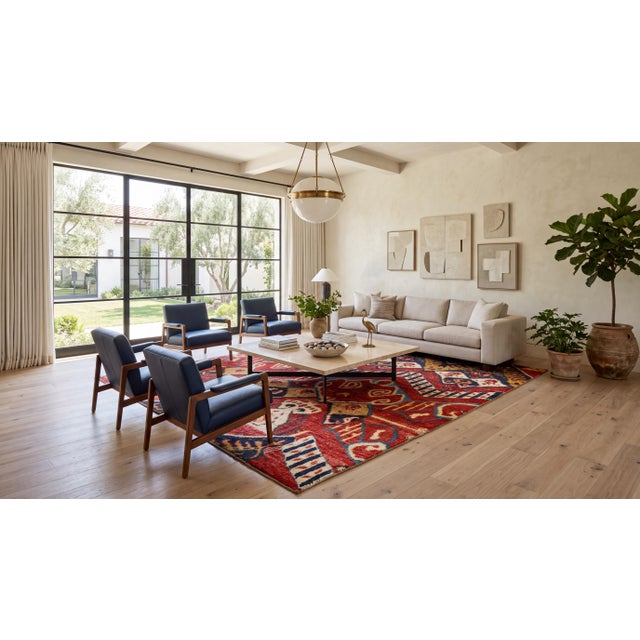 Hand-knotted with premium natural wool, this Modern Moroccan style area rug features a striking graphic composition...