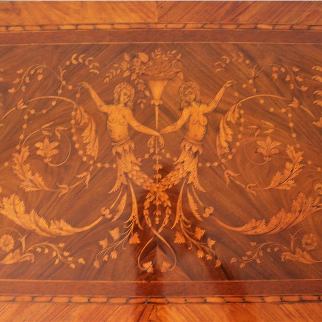 Elegant Louis XV style dresser, entirely paved and richly inlaid with characters and garlands, bullied engravings. The...