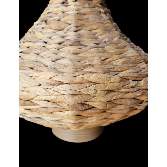 A beautiful twisted seagrass large genie style table lamp with black shade. The table lamp features a large genie style...