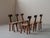Set of six solid chestnut chairs handcrafted in France during the 1970s, It embodies a deliberately primitive and...