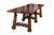 Carved walnut dining table featuring a hand forged, wrought iron stretcher and three sets of undulating trestles.