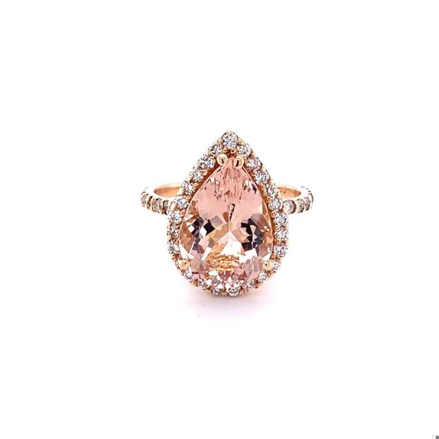 5.58 Carat Pear Cut Morganite Halo Diamond Rose Gold Engagement Ring A gorgeous ring that can easily be transformed into...