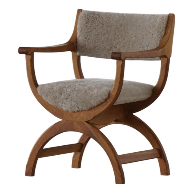 Mid-Century Kurul Armchair in Oak and Lambswool attributed to Henning Kjærnulf, 1960s For Sale
