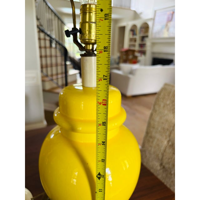 A striking pair of vintage ceramic table lamps finished in an exceptionally vibrant yellow crackle glaze. These lamps...