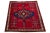 Vintage Shiraz Handmade Wool Rug. This rug has a red field with a multicolor medallion design. This rug measures 5'9" x 7'2".