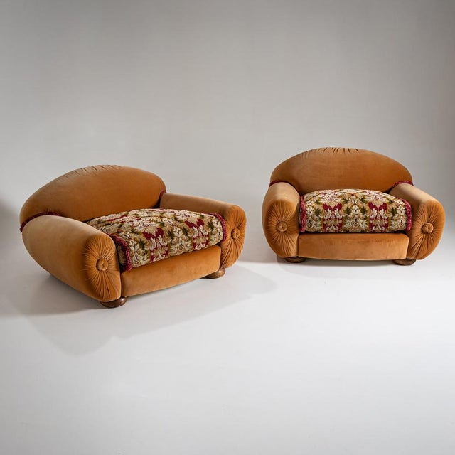 Playful pair of vintage lounge chairs with generously rounded, "bubbly" forms, upholstered in golden velvet. The...