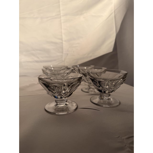 An elegant set of six antique crystal champagne coupes from the prestigious French manufacturer Baccarat. This is the...