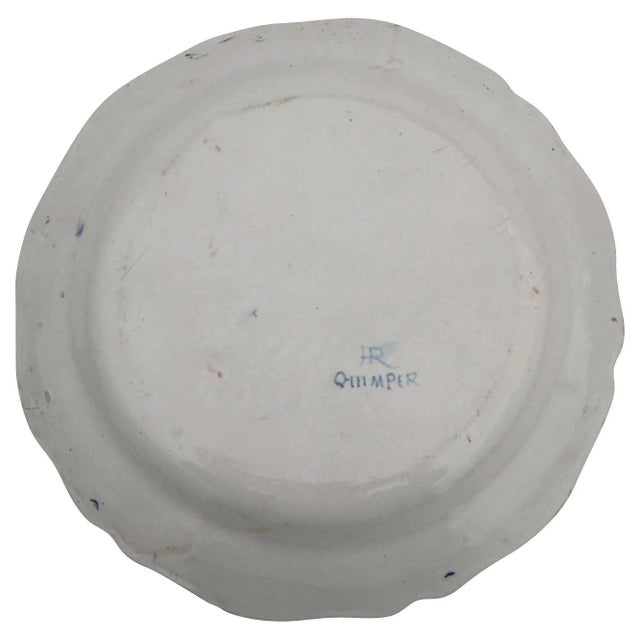 Large French platter signed HR Quimper, circa 1880. This very large platter of 12" is decorated with a Bretonne women who...