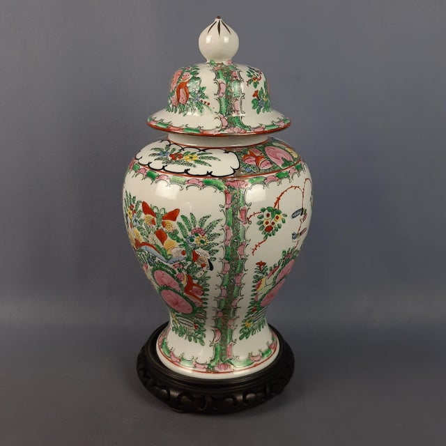 A stunning vintage decorative porcelain potiche vase of oriental inspiration, original and marked on the base. Subject and...