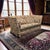 Large English Knole-style four-seat sofa featuring dramatic rolled arms, turned finials, and a substantial manor-house...