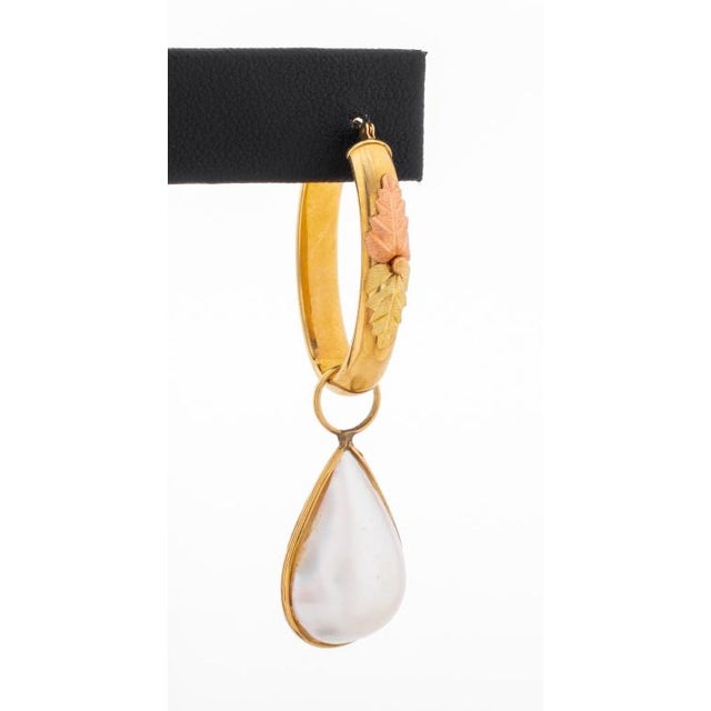 12K "Black Hills Gold" hoop earrings, with 14K yellow gold detachable pearl drops, worn through pierced earlobes with...