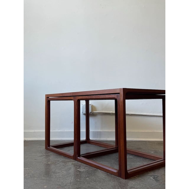 We have a gorgeous set of tables in the style of Arne Hovmand-Olsen for Mogens Kold crafted from richly grained, warm teak...