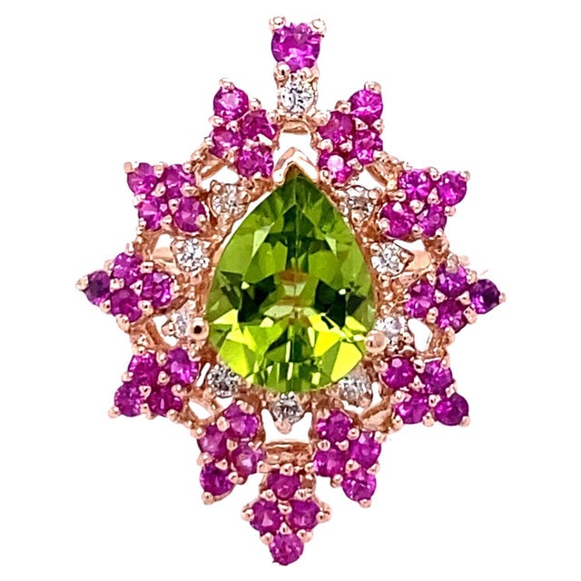 3.51 Carat Natural Peridot Sapphire Diamond Rose Gold Cocktail Ring This beautiful ring has an Pear Cut Peridot that...