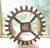 A large reclaimed antique industrial wooden foundry toothed cogwheel gear mold as a modern free-standing or wall...