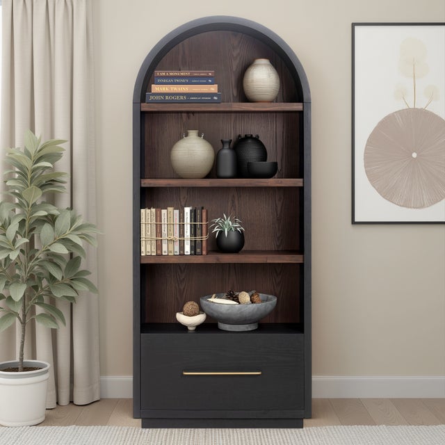 The Marlow Bookcase with File Drawer blends sculptural form with practical storage. Its soft curves, open shelving, and...