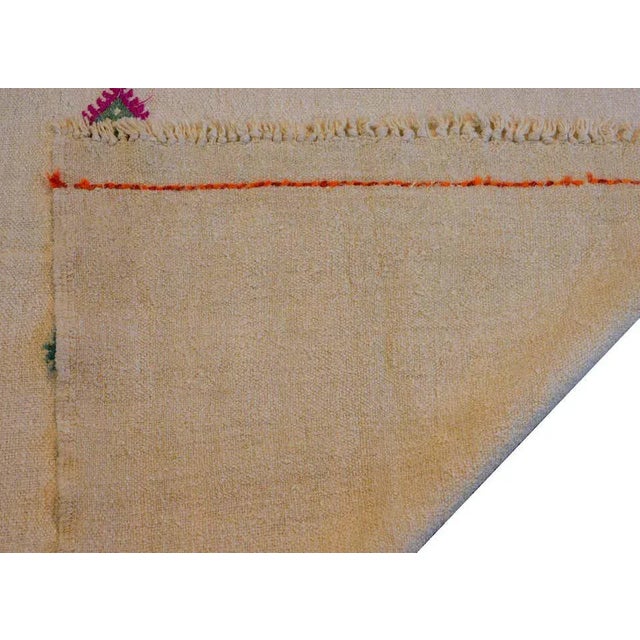 A wonderful mid-20th century Turkish Konya kilim rug with a simple pattern of stylized diamond medallions woven in...