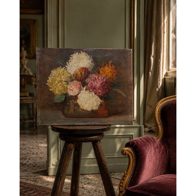 An oil on canvas, circa 1900 — chrysanthemums in full bloom, rendered with a confidence and tenderness that only comes...