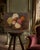 An oil on canvas, circa 1900 — chrysanthemums in full bloom, rendered with a confidence and tenderness that only comes...