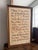 This is a framed piece of Gregorian chant music. This is an antique. I believe this is done of a piece of animal skin or...
