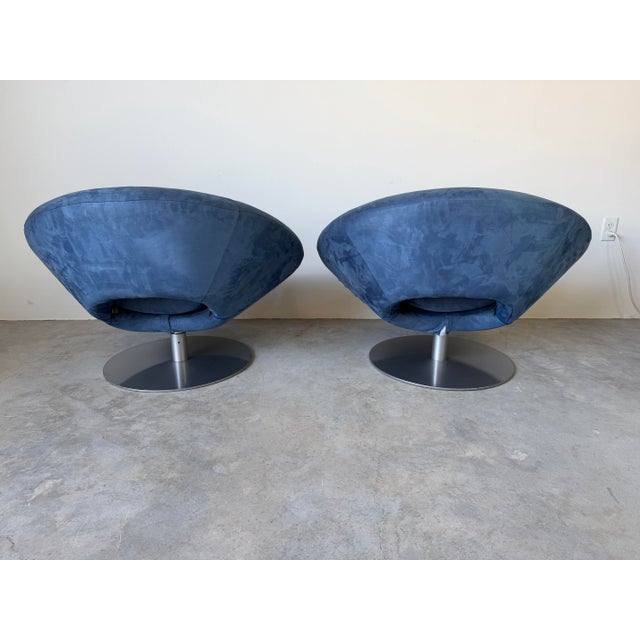 Exceptional pair of Italian Arketipo “Moon” swivel lounge chairs designed by Manzoni & Tapinassi in the early 2000s. These...