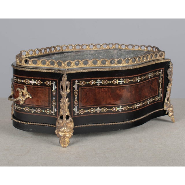 A fine 19th century French Napoleon III marquetry jardinière, or cache pot, made with inlaid veneers of burled walnut with...