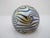 Vintage Robert Eickholt "King Tut" art glass paperweight, featuring sweeping, iridescent gold and blue-silver swirls over...