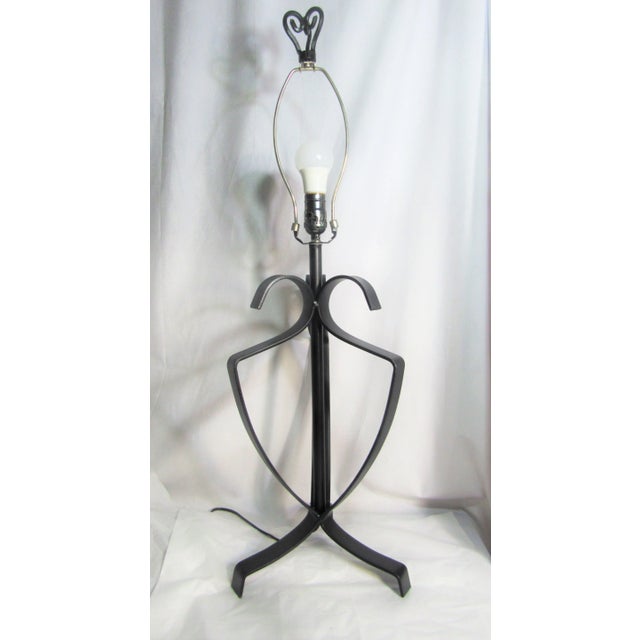 Just the lamp measures 23" not including finial and harp. Dramatic black open iron work. I know it is old, but I don't...