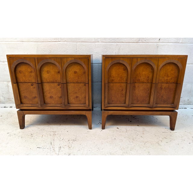 Elegant pair of vintage Mid-Century Modern nightstands by Thomasville, featuring rich walnut construction, striking...