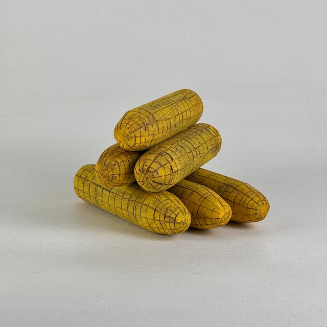 An authentic set of 6 primitive hand carved and painted corn cob decoys. These wooden cobs were used along with field...