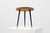 A sleek Italian mid‑century side table from the 1950s, featuring a circular wooden top with a geometric veneer pattern and...