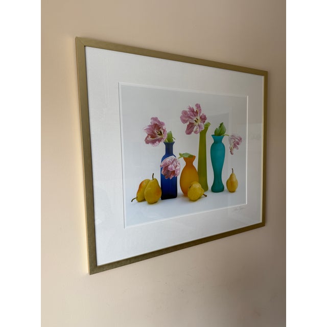 Vintage Robin Logan Signed Colorful Glass Bottles and Floral Still Life Lithograph. This piece features is part of the...