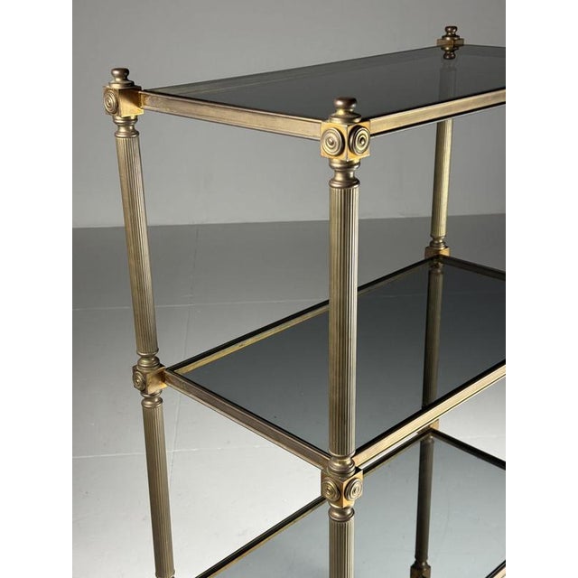 1 Mid-century bookcase / étagère. Presumably from the 1960s. Heavy metal frame with tinted glass shelves. Beautiful patina...