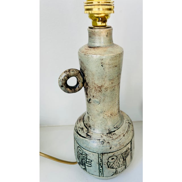 Very pretty lamp base decorated with birds, in ceramic by the ceramist Jacques Blin. In gray/green tones, the lamp has...