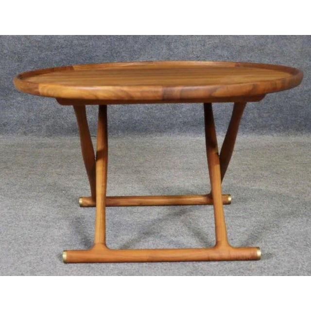 Round dish shaped coffee table made by Mogens Lassen for Carl Hansen & Son. Featuring a beautiful 'x' base in teak wood...
