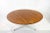 Teak coffee table on three legged aluminium base by Arne Jacobsen for Fritz Hansen. H 47 cm Diam 110 cm. This piece has an...