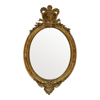 19th Century French Louis XVI Style Carved and Giltwood Oval Mirror For Sale
