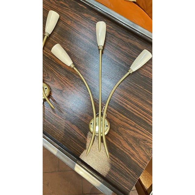 Pair of 1960s brass and aluminum wall sconces in good condition. European Plug (up to 250V).The wiring of this item may be...