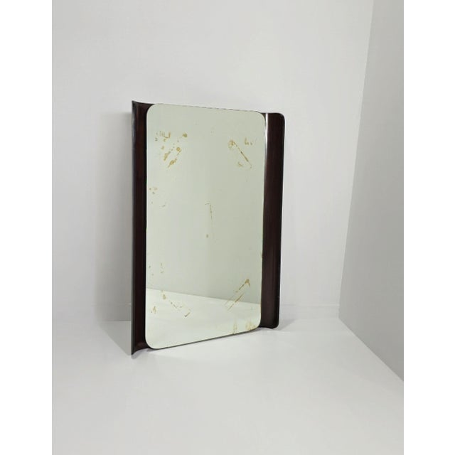 Mid-Century Italian Wall Mirror in Curved Teak, 1960s, in Good conditions. Designed 1970 to 1979