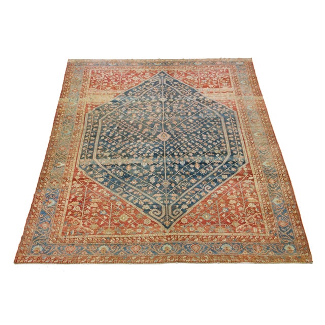 Beautiful Antique Bakhtiari hand-knotted wool rug with a blue color field. This Persian piece has a classic geometric...
