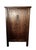 The tall cabinet with double doors and slightly recessed sides represents traditional Chiinese furniture craftsmanship...