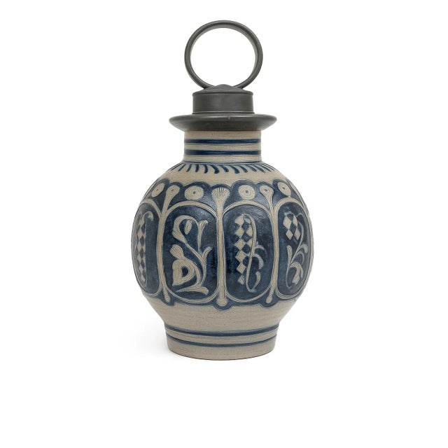 A finely crafted antique German salt-glazed stoneware jug from the Westerwald region, celebrated for its gray clay and...