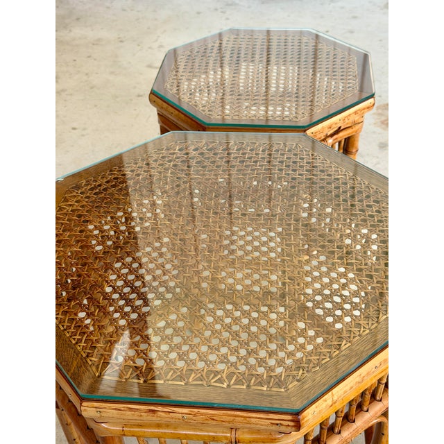 Pair of Mid-20th Century Brighton Pavilion style bamboo and cane side tables featuring classic octagonal forms with inset...