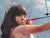 In "Impenetrable Princess," a young girl in a delicate dress confidently draws back a bow, poised against a backdrop of...